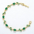 Detail view of gold leafy vine bracelet with green gemstones and elegant clasp - Gold Green Tulip Bracelet
