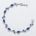 Macro detail of silver vine bracelet with deep blue marquise gemstones and fold-over clasp - Silver Blue Tulip Bracelet