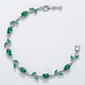 Macro detail of leaf vine bracelet with green oval crystals and silver plating - Silver Green Tulip Bracelet