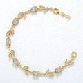 Detailed macro view of gold-toned leaf bracelet with marquise-cut sparkling zircons - Gold White Tulip Bracelet