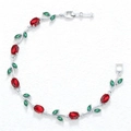 Macro shot of silver vine bracelet with red oval gems and green marquise stones - Silver Red Green Tulip Bracelet