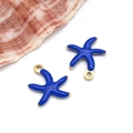 Detail view of blue enamel starfish charms with gold plating and natural sea shell decor - Small Gold Royal Blue Style (T1168)