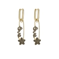 Detail of golden safety pin earrings featuring black zircon 'Love' text and star charms - Gold Black Stone