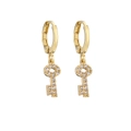 Macro view of gold key pendant earrings featuring micro-pave cubic zirconia crystals - Gold Key Style (No. 11)