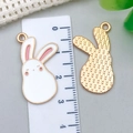 Detail view of cartoon rabbit alloy pendants with size reference and front-back texture - White Rabbit Style (21134)