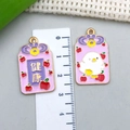 Detailed macro view of alloy omamori pendants with health text and cute chicken designs - Purple Chick Apple Health Blessing Pendant (23214)