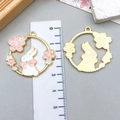 Detail of bunny and cherry blossom enamel charms with a ruler showing 3.3cm size - White Bow Flower Rabbit Hollow Wreath (23181)