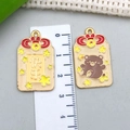 Japanese gold alloy lucky charm pendant with bear and happiness text in yellow enamel - Brown Bear Star Happiness Blessing Pendant (23216)