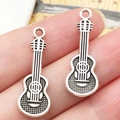 Macro-opname van zilveren gitaarhangers met verfijnde details voor DIY-sieraden maken - 28x10mm Antiek Zilveren Viool