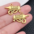 Antique gold wine bottle pendants for DIY jewelry making, set of two pieces - Horizontal Bottle Shape