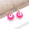 Detail of pink evil eye charms with gold metal casing and enamel drip finish - Small Round / Rose Red