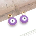 Detail view of 6mm purple evil eye charms with gold-plated edges for DIY jewelry making - Small Round / Purple