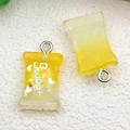 Resin candy-shaped charms in yellow gradient with 'Sweet' text and silver metal hooks - Yellow Gradient Resin Candy (17115)