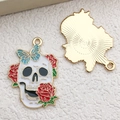 Detail of Halloween skull pendant with red roses and teal butterfly on a golden base - Rose Skull Style (18164)