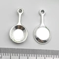 Detailed view of silver frying pan pendants for DIY jewelry making with ruler scale - Small Pan (8835)