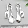 Macro view of vintage silver alloy spoon and fork pendants with measurement scale - Fork and Spoon Combo (18823)