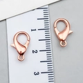 Pair of rose gold lobster clasps with smooth metallic finish for DIY jewelry - Rose Gold