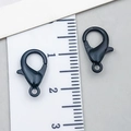 Matte black alloy lobster clasps for DIY jewelry making shown with size ruler - Swimming Black
