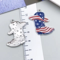 Detailed macro of patriotic cowboy hat and boot charms with measurement ruler for DIY - Silver Blue Enamel Boots (23534)