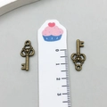 Pair of vintage bronze hollow key charms for DIY jewelry making measures 3.1cm in length - Key Style (6948) / 2.2cm x 0.9cm