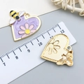 Detailed view of heart-shaped enamel bee and daisy charms with golden mesh texture back - Purple Gold Heart Bee Flower (23594)