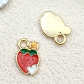 Vibrant red strawberry enamel pendant with green leaves and a golden metal finish - Drip Oil Strawberry (10846)