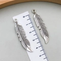 Vintage silver feather pendants for DIY jewelry with ruler showing 4.5cm length - Antique Silver (B296)
