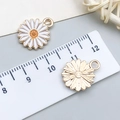 Daisy enamel charm for DIY jewelry with white petals, gold trim, and a size scale guide - White Enamel Small Daisy (14789)