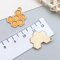 Beehive charms in orange enamel with honey comb pattern and metal back for DIY crafts - Single-Sided Yellow Enamel Honeycomb (21126)