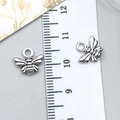 Vintage silver bee alloy charms for DIY jewelry making shown with size reference ruler - Small Bee (6541)