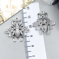 Antique silver bee charms for DIY jewelry making with ruler showing 3cm size - Bee (7226)
