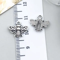 Antique silver bee metal charms for DIY jewelry making shown with size scale ruler - Bee (9185)