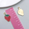 Front and back views of red oil-drop strawberry alloy pendant for jewelry making - 1Pc KC Gold Red Enamel Cherry (23441)