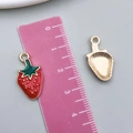 Red strawberry fruit pendant charm with gold accents and green leaves for DIY jewelry - 1Pc Enamel Red Strawberry (8619)