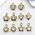 Colgantes geométricos de acero inoxidable dorado con cristales claros variados - Mezcla de 10 Colgantes Dorados (SN1436)