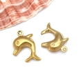 Macro shot of two matte gold dolphin pendants with shell decoration on white background - Large Dolphin (T1969)