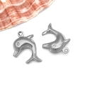 Macro view of silver dolphin charms in stainless steel for DIY jewelry making - Large Dolphin (T1977)