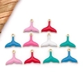 Detailed flat lay of ten colorful enamel fish tail pendants for DIY jewelry making - Random 10 Pcs / Gold Mermaid Tail (T2748)