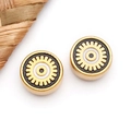 Macro detail of gold stainless steel Evil Eye beads with intricate geometric enamel pattern - Black Enamel Round (T1712)