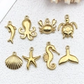 Golden stainless steel ocean pendants set featuring sea turtle starfish and seashell - Ocean Series Mix 8 Styles Each 1 (SN1427)