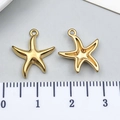 Macro detail of golden starfish pendants showing polished front and hollow back designs - Gold Sea Star Style (T3029)