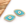 Detailed close-up of turquoise evil eye beads with gold lashes for DIY jewelry making - Blue Eye With Lashes (T1685)