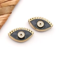 Detail view of evil eye stainless steel beads with gold plating and enamel inlay - Black Eye With Lashes (T1686)