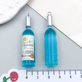 Ciondolo a forma di bottiglia di vino in resina blu con anello in argento e etichetta - Bottiglia di Vino in Resina Blu Trasparente
