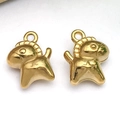 Macro view of two golden pony charms with polished finish for DIY jewelry making - Animal Rocking Horse