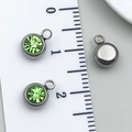 Green crystal round pendant in stainless steel setting with size scale ruler measurement - Steel-Light Green