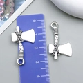 Detail view of vintage silver axe charms for DIY jewelry with ruler for scale - Antique Silver Axe Style (18406)