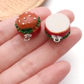 Macro shot of miniature resin hamburger pendants with detailed layered ingredients and rings - Light Coffee
