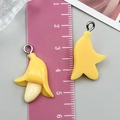 Macro detail of 3D resin banana charms showing realistic textures and silver jump rings - Banana Style C (24382) / 1 Piece (25x18x8mm) / Yellow