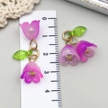 Detailed macro view of purple acrylic lily of the valley pendant with green leaf and golden metal - Lily of the Valley Pendant (23262)